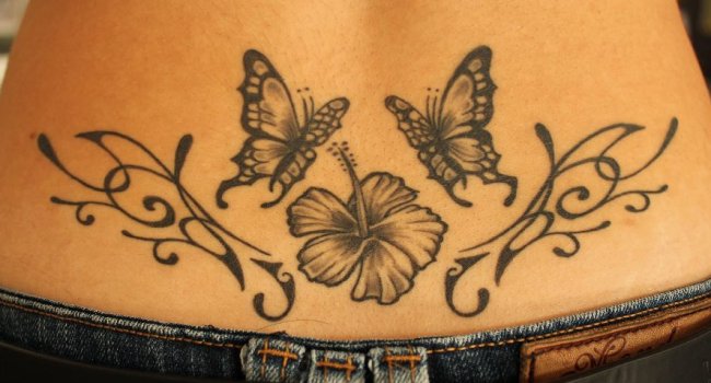 tatoo bas du dos arabesque